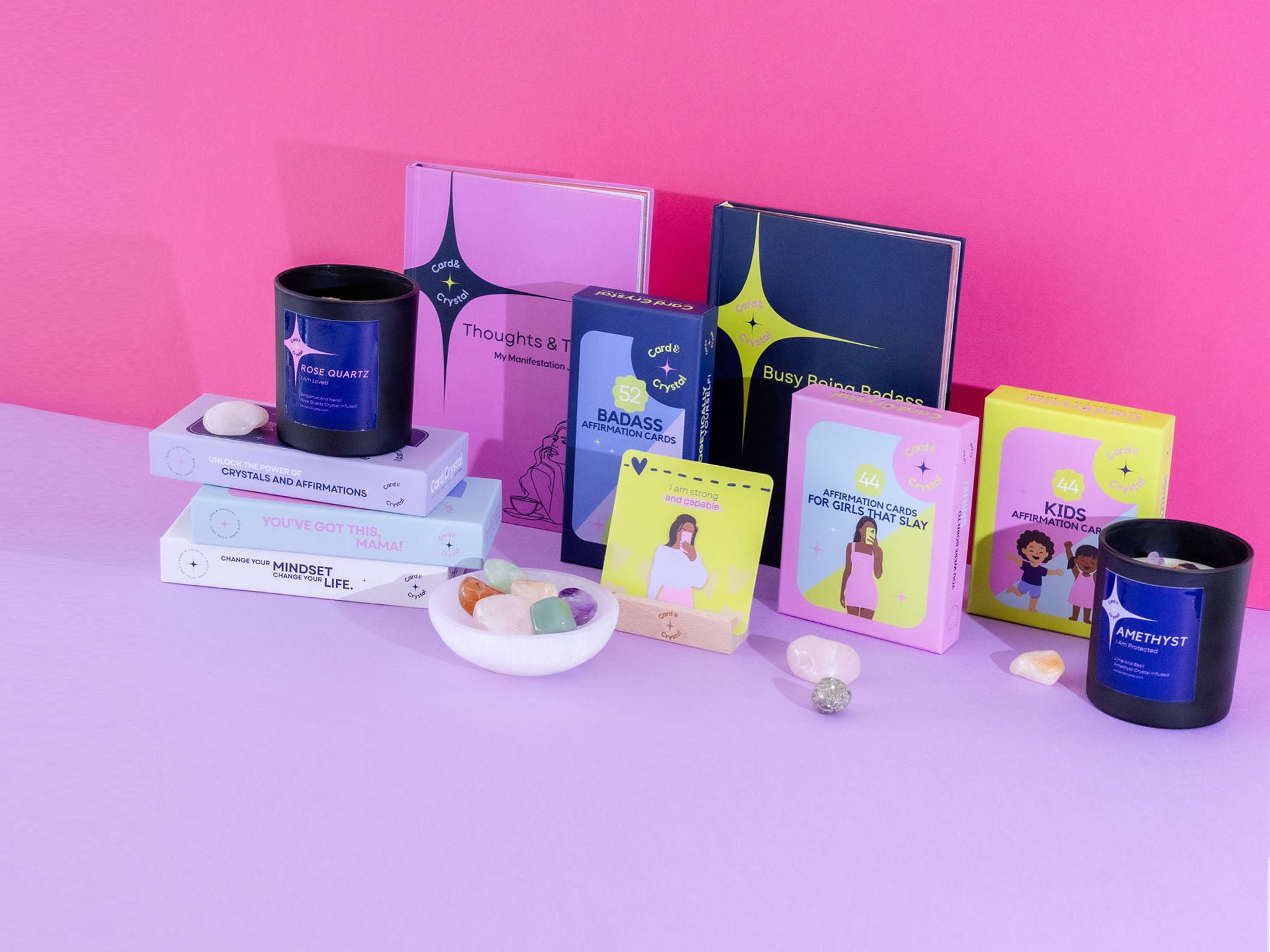 assorted Card and Crystal products with journals, affirmation cards, crystals, and crystal-infused candles