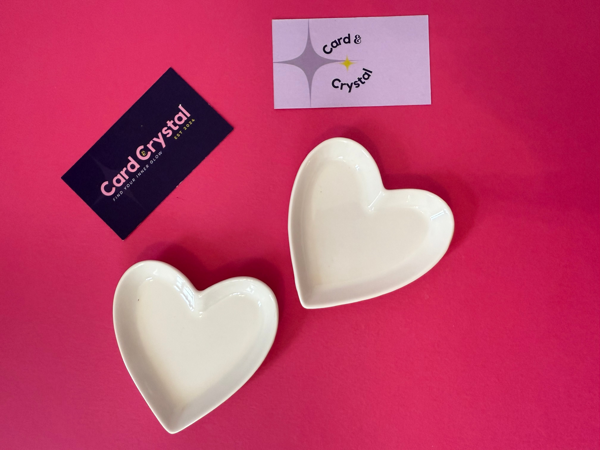 Two heart-shaped ceramic bowls on a pink background with 'Card Crystal' branding.